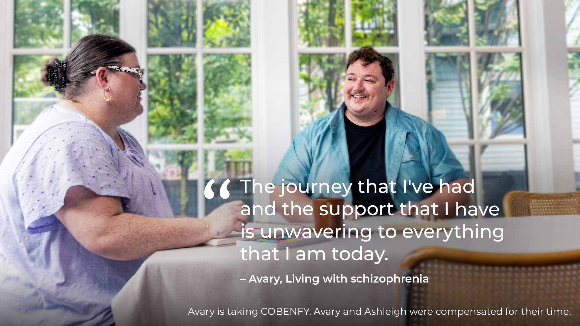 Avary, an actual COBENFY (xanomeline and trospium chloride) patient, sitting at a dining table with his wife Ashleigh