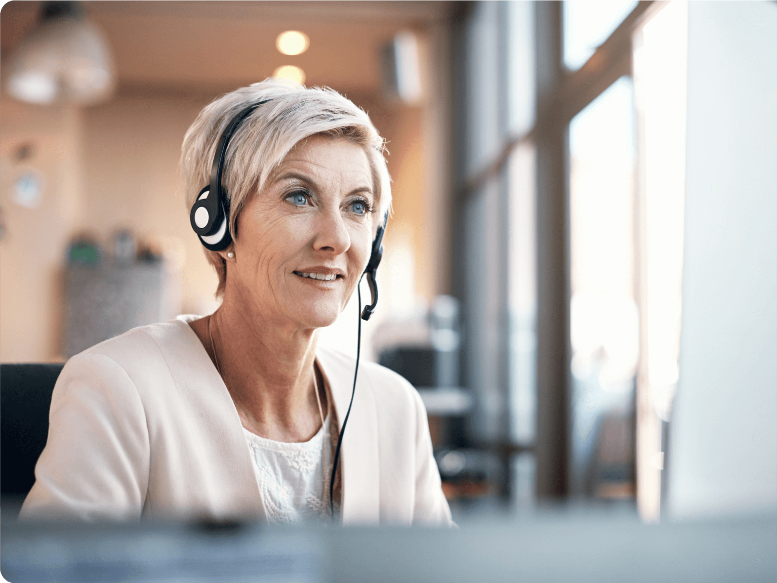 Photo of a blond woman wearing a headset