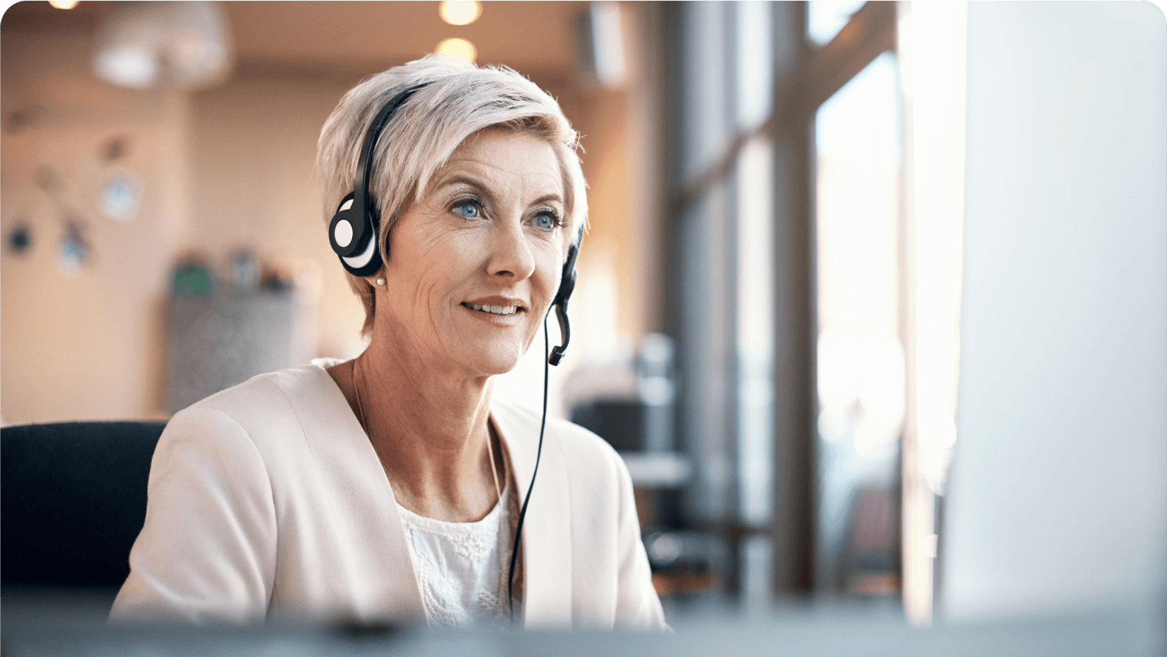 Photo of a blond woman wearing a headset